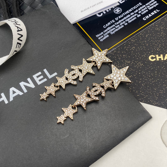 Pendientes colgantes de estrella con diamantes