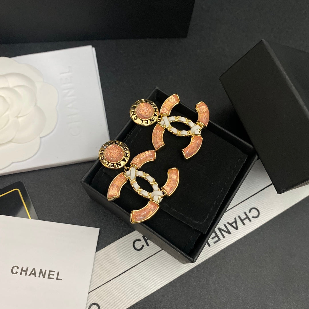Boucles d'oreilles en cuir brillant à logo