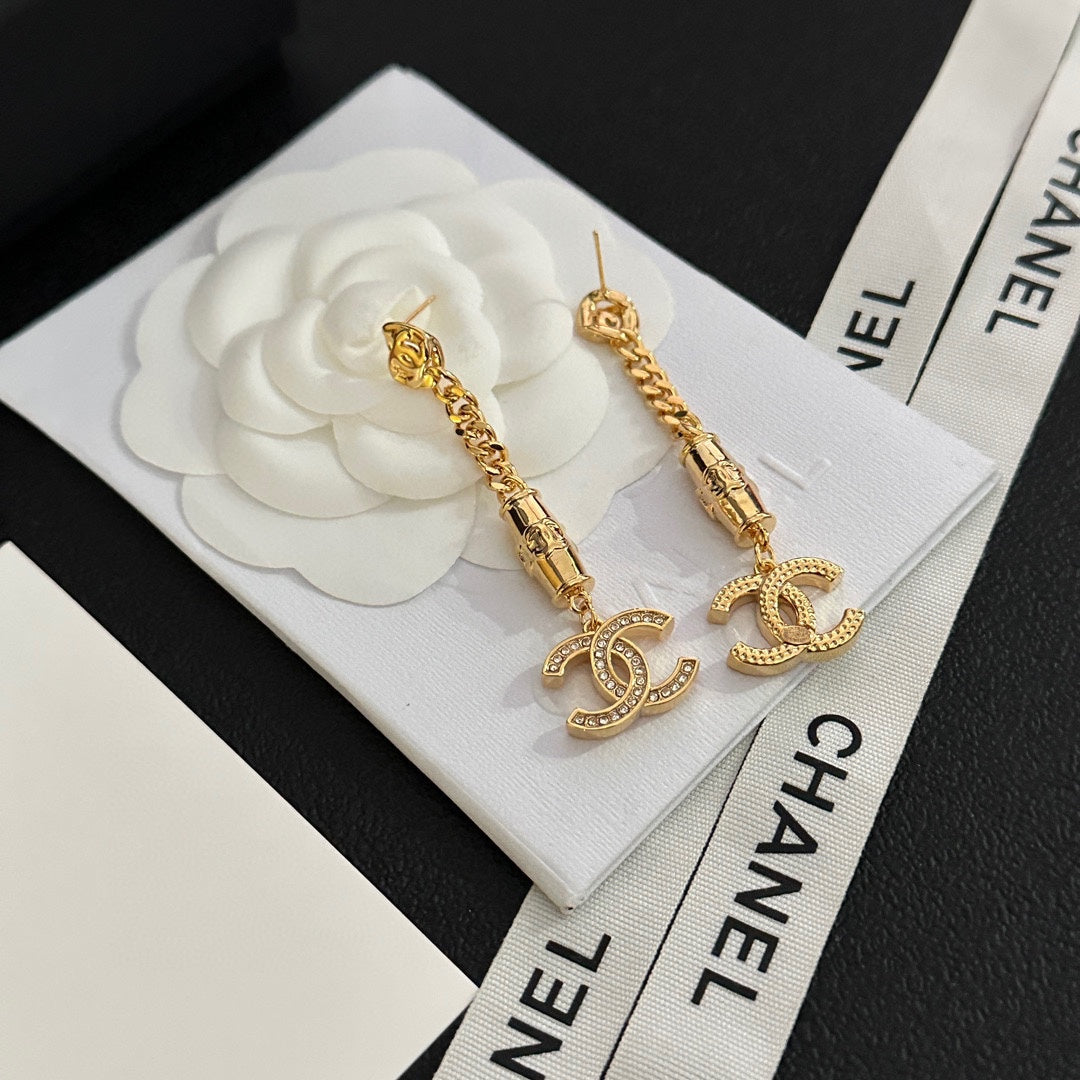 Boucles d'oreilles pendantes en strass doré