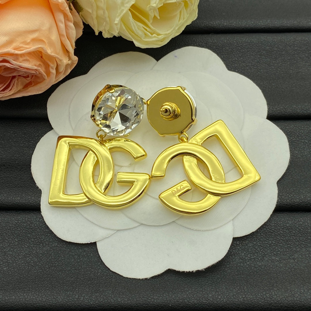 Boucles d'oreilles pendantes à logo doré