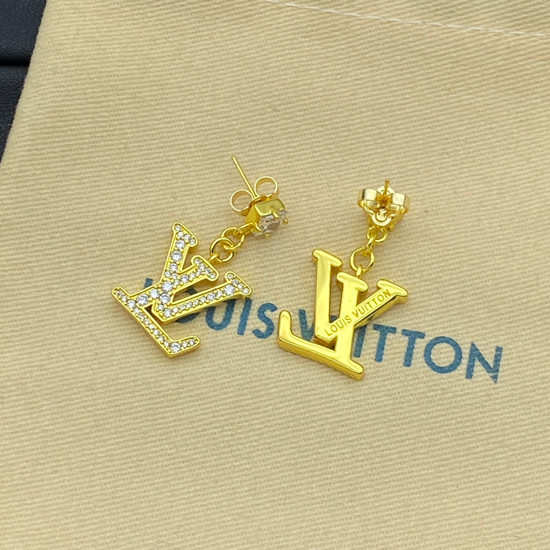 Boucles d'oreilles pendantes logo diamant avec cristaux