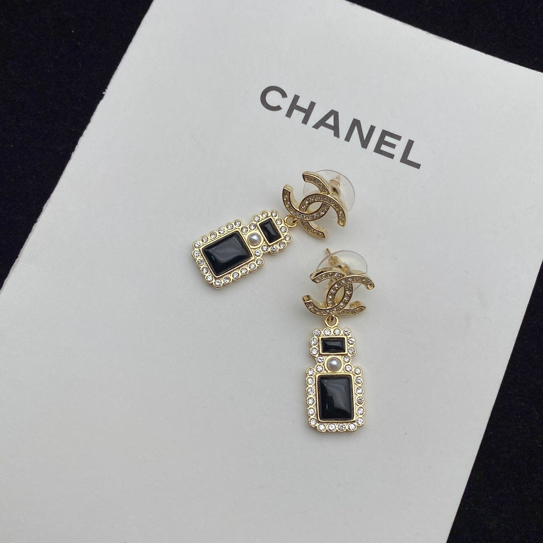 Boucles d'oreilles pendantes élégantes en forme de flacon de parfum
