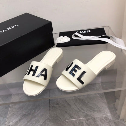 Mules en cuir motif alphabet blocs de couleur