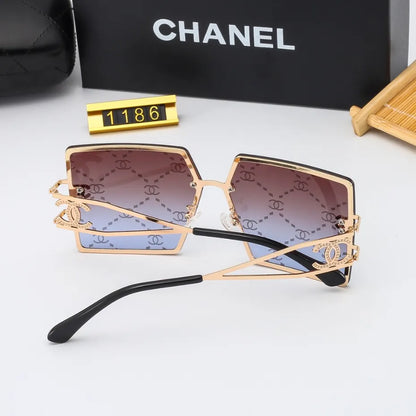 Lunettes de soleil rétro avec monture en métal et lettres en filigrane