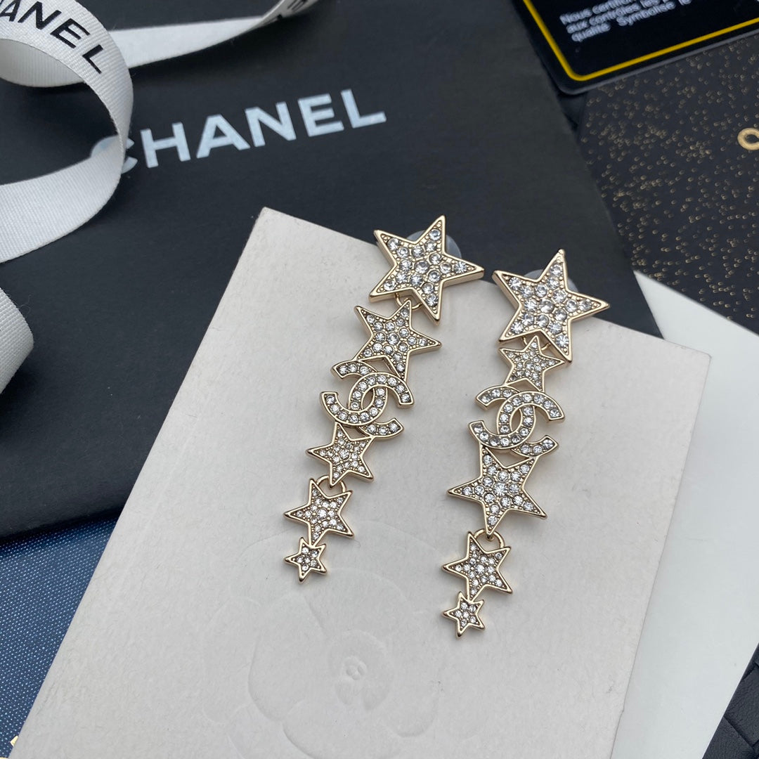 Pendientes colgantes de estrella con diamantes
