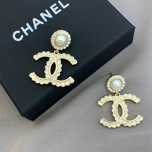 Boucles d'oreilles pendantes perle double C