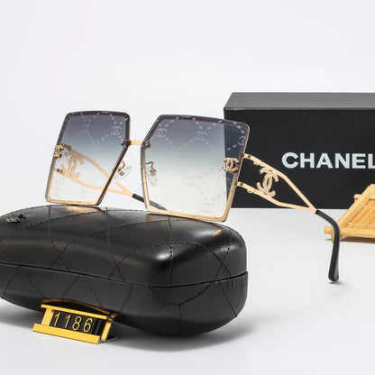 Lunettes de soleil rétro avec monture en métal et lettres en filigrane