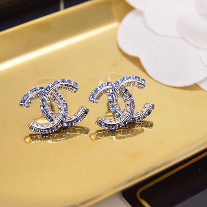 Boucles d'oreilles lettre diamant double rangée bleues