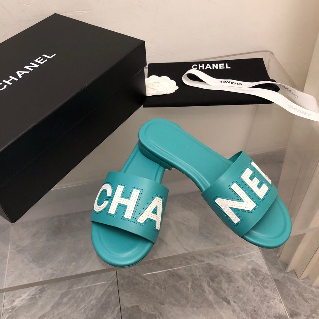 Mules en cuir motif alphabet blocs de couleur