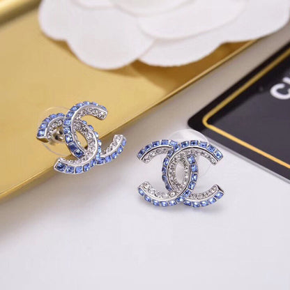 Boucles d'oreilles lettre diamant double rangée bleues