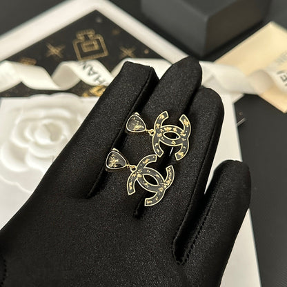 Pendientes vintage negros con hojas doradas
