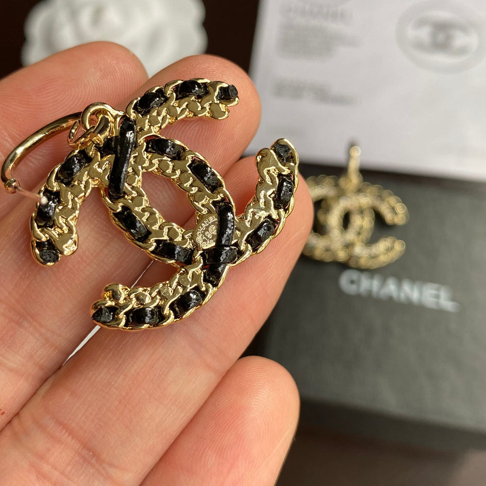 Pendientes colgantes de cuero negro y dorado
