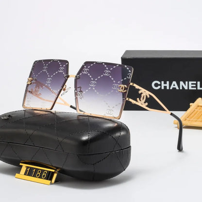 Lunettes de soleil rétro avec monture en métal et lettres en filigrane