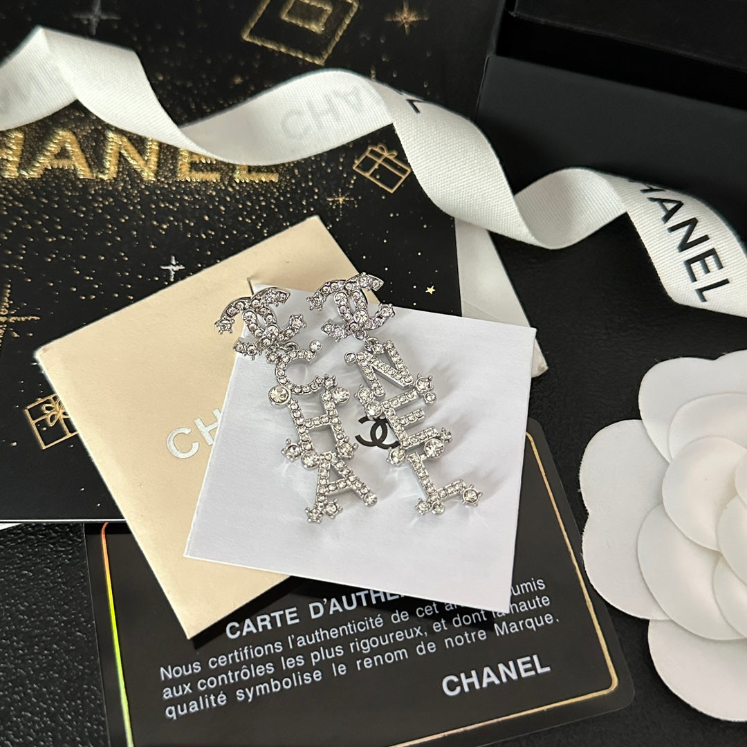 Pendientes colgantes con inicial de diamante