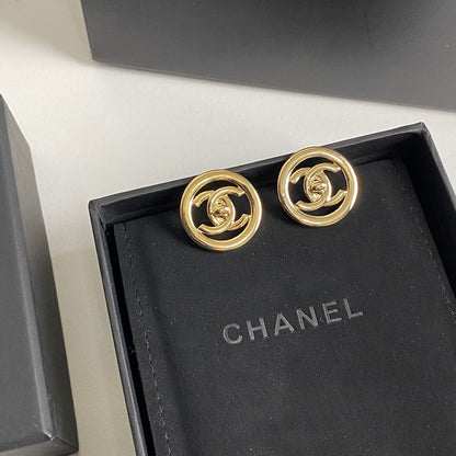 Boucles d'oreilles créoles logotées en métal doré