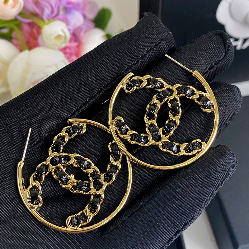 Boucles d'oreilles en cuir noir et ton or