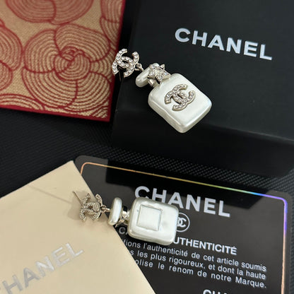Boucles d'oreilles pendantes flacon de parfum blanc