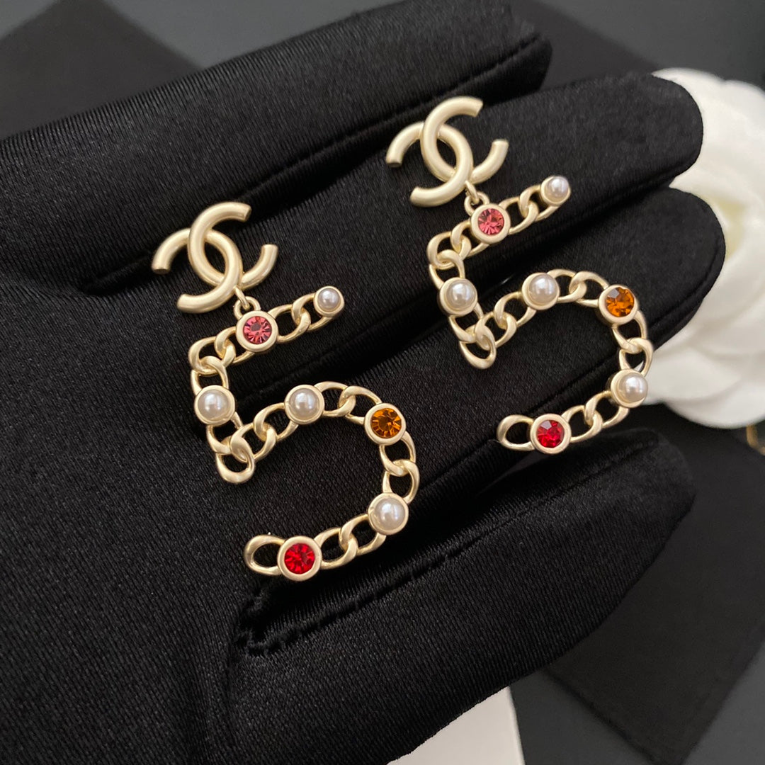 Nouvelles boucles d'oreilles n°5 en diamant de couleur