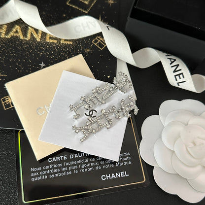 Pendientes colgantes con inicial de diamante