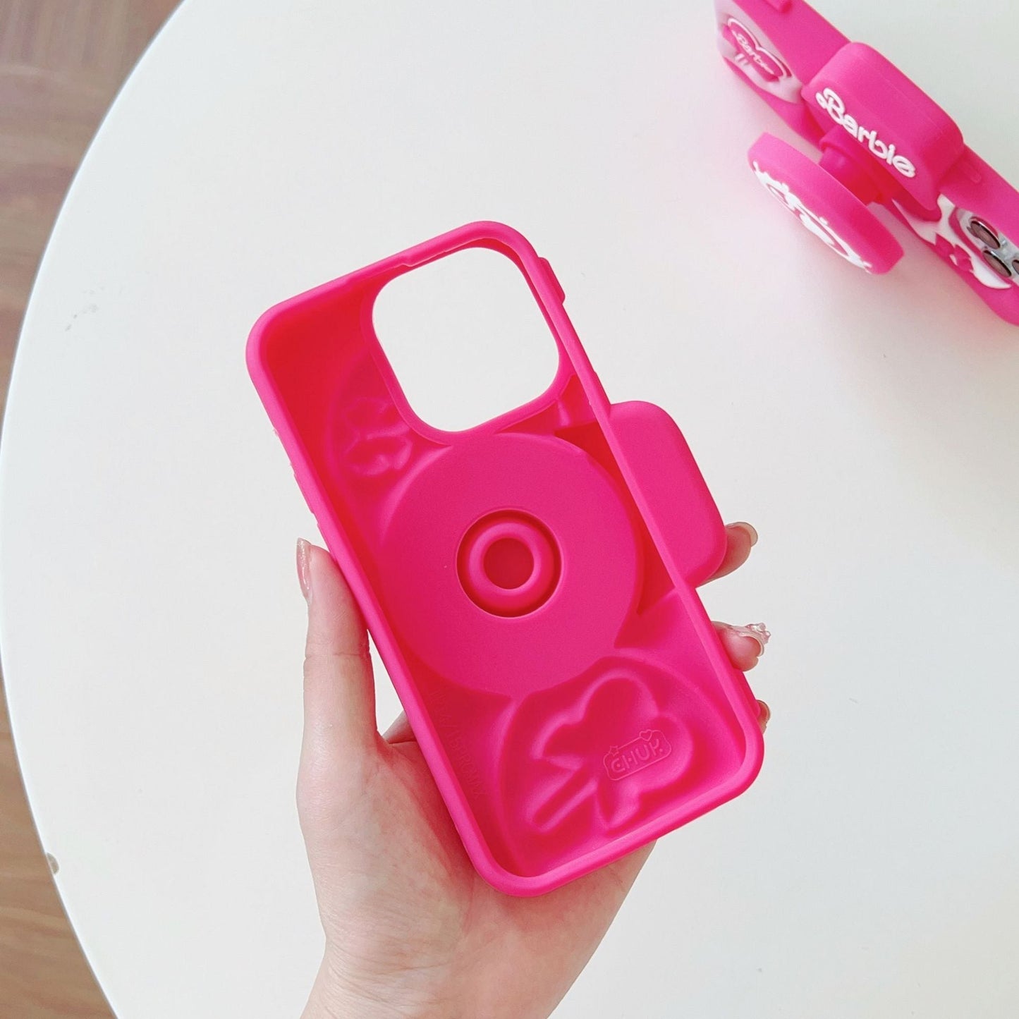 Preciosa funda de silicona rosa para cámara