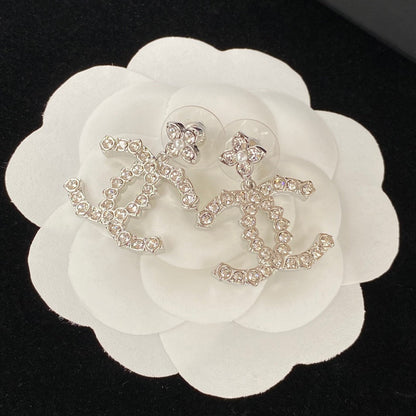 Boucles d'oreilles fleur scintillante en zircon