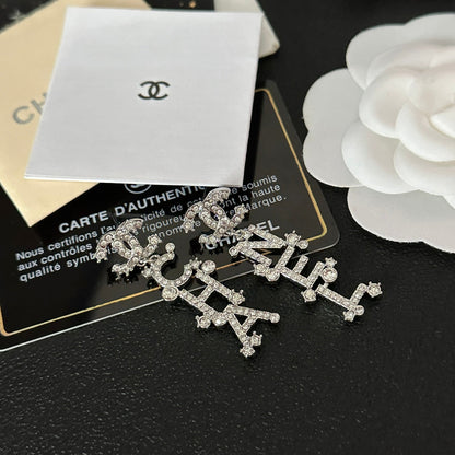 Pendientes colgantes con inicial de diamante