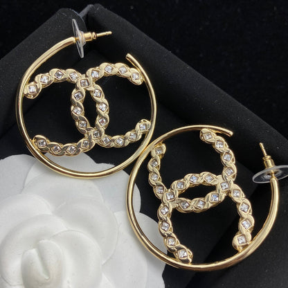 Arracadas de oro con inicial de diamante