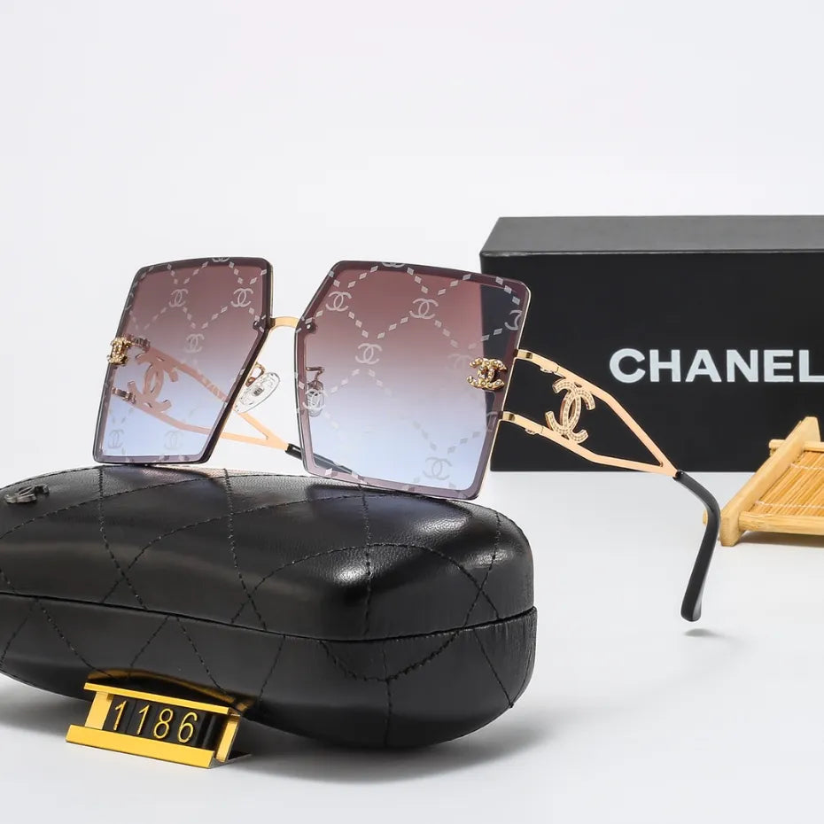 Lunettes de soleil rétro avec monture en métal et lettres en filigrane
