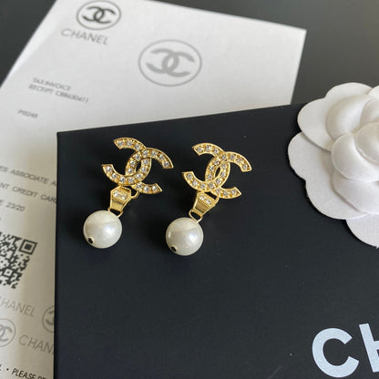 Boucles d'oreilles pendantes diamant et perle