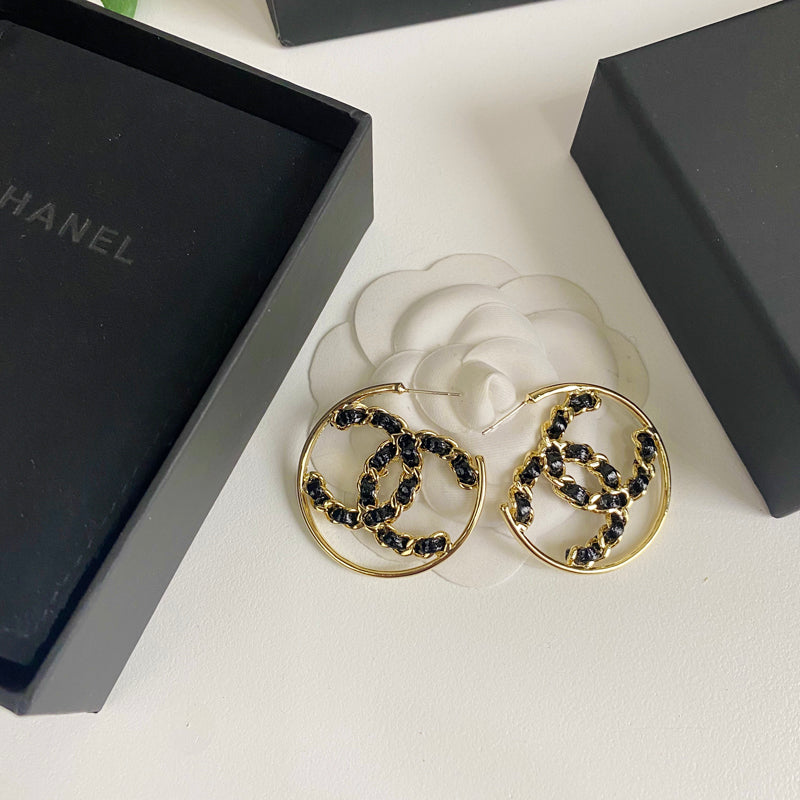 Boucles d'oreilles en cuir noir et ton or