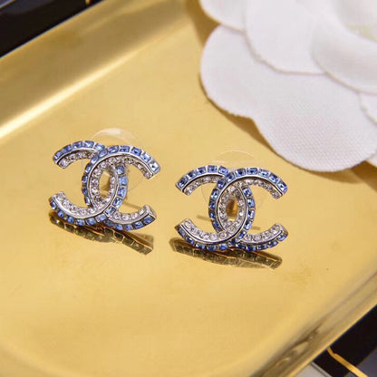 Boucles d'oreilles lettre diamant double rangée bleues
