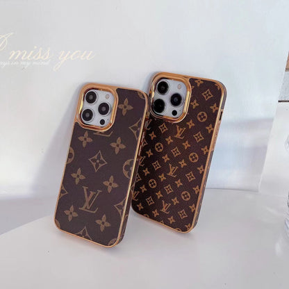 Étui en cuir monogrammé à cadre métallique