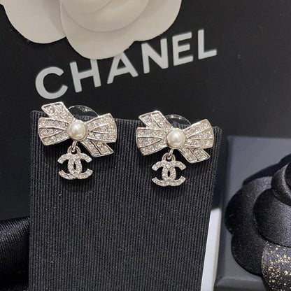 Boucles d'oreilles nœud zircon scintillant
