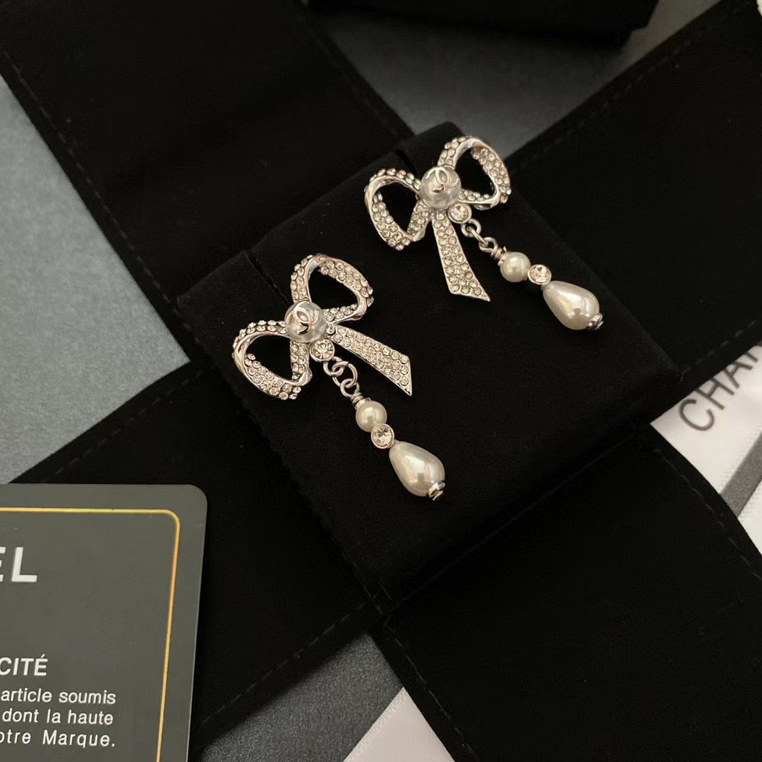 Boucles d'oreilles nœud en diamant de cristal de tempérament