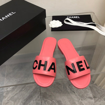 Mules en cuir motif alphabet blocs de couleur
