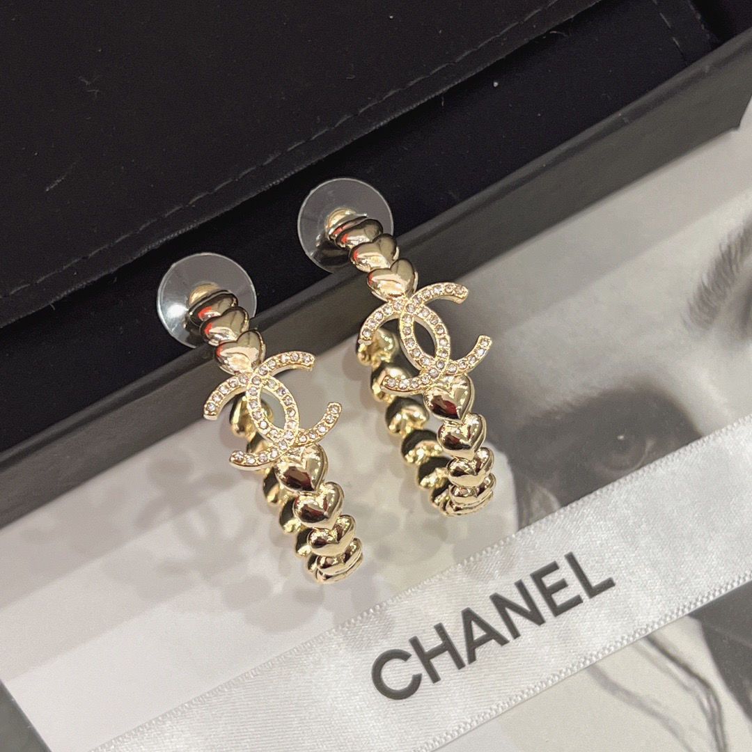 Boucles d'oreilles créoles logo en cristal
