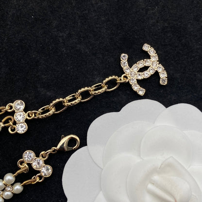 Pulsera de doble fila de perlas y diamantes