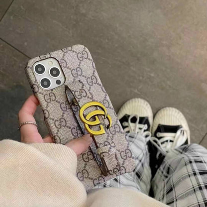 Étui en cuir avec bracelet à monogramme