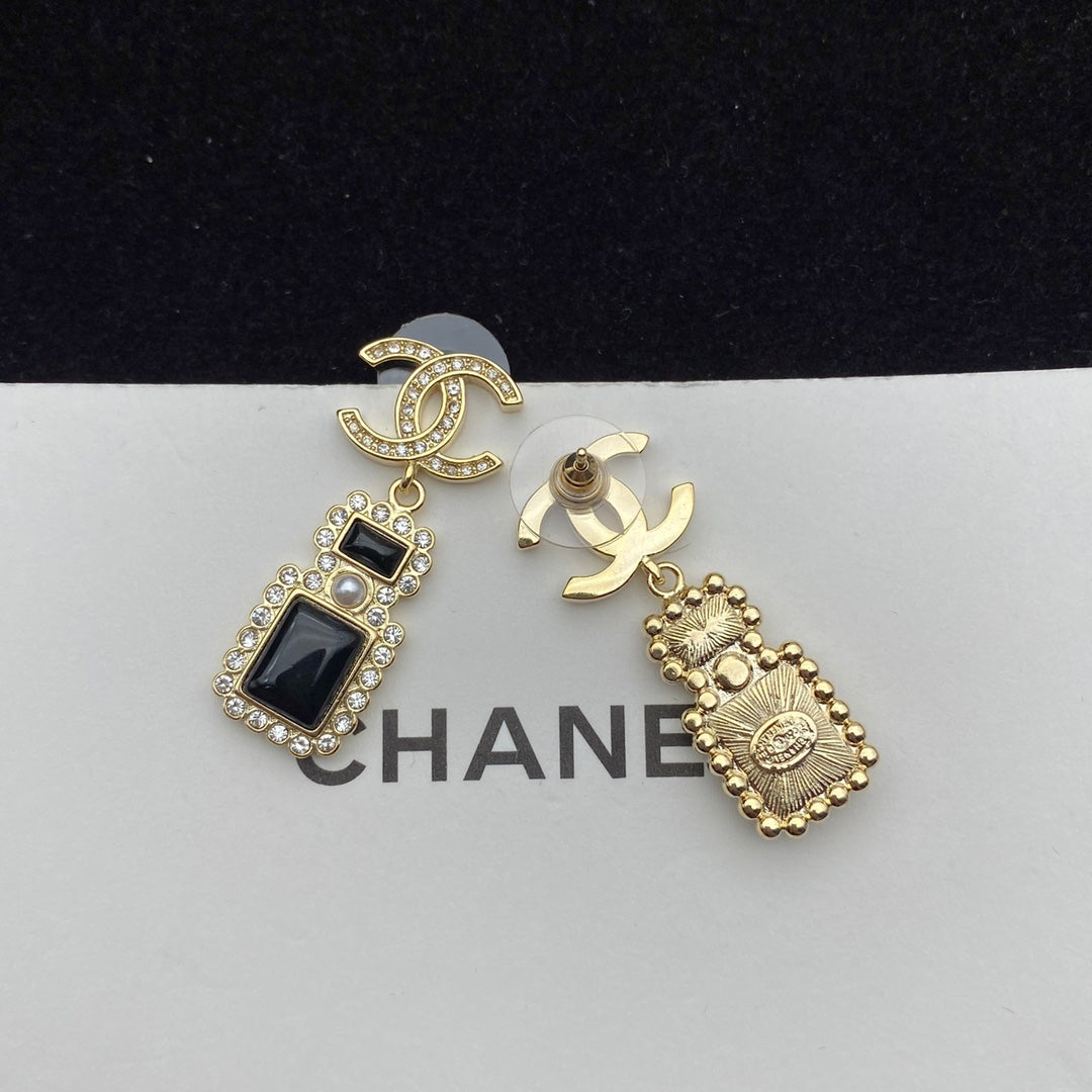 Boucles d'oreilles pendantes élégantes en forme de flacon de parfum