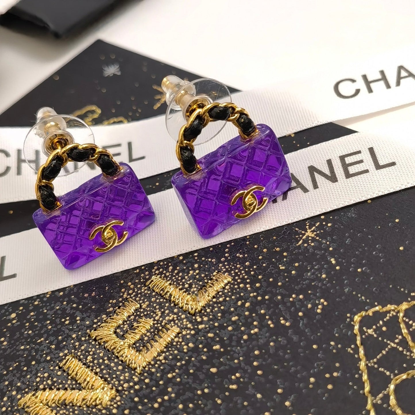 Boucles d'oreilles sac élégantes violettes