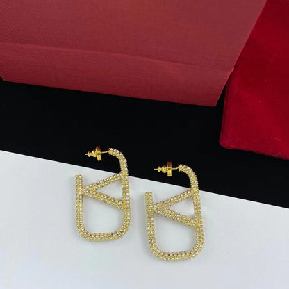 Pendientes con logotipo de metal con diamantes completos