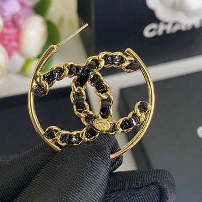 Boucles d'oreilles en cuir noir et ton or