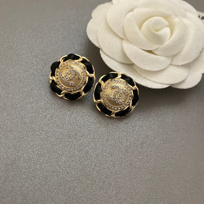 Boucles d'oreilles en cuir noir et doré