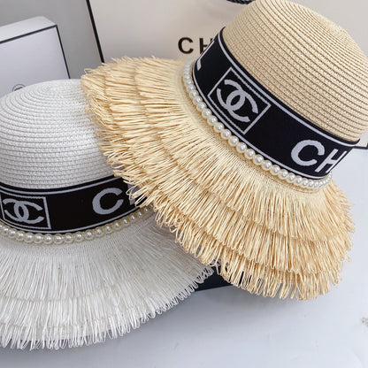 Sombrero de paja con flecos y perlas