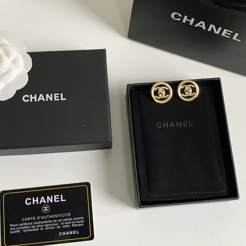 Boucles d'oreilles créoles logotées en métal doré