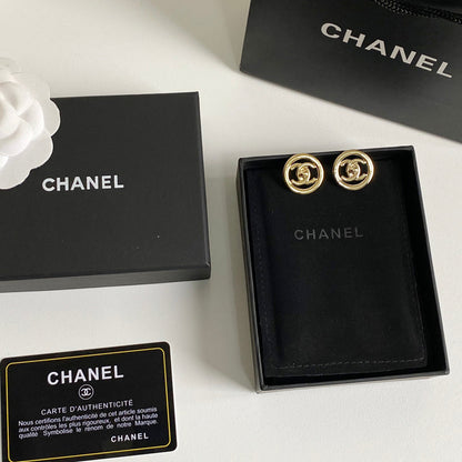 Boucles d'oreilles créoles logotées en métal doré