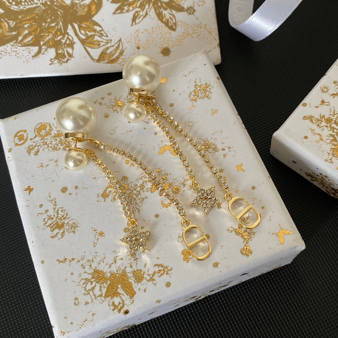 Boucles d'oreilles étoiles en métal finition dorée avec perles