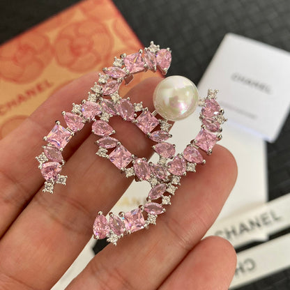 Broche con logo de Perla de Cristal Brillante