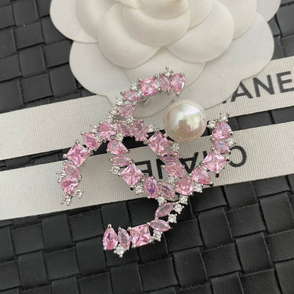 Broche con logo de Perla de Cristal Brillante
