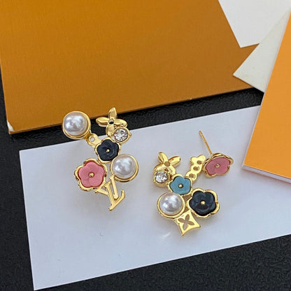 Aretes de moda asimétricos florales